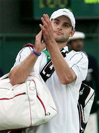 Andy Roddick Carrying Two Man Bags